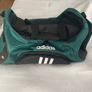Large green and black adidas duffel bag